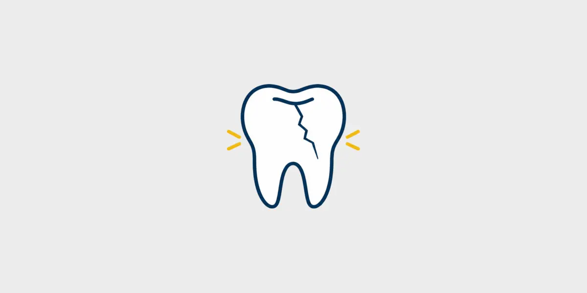 Navy and gold line icon of a cracked tooth with small sensitivity marks on a light gray background.