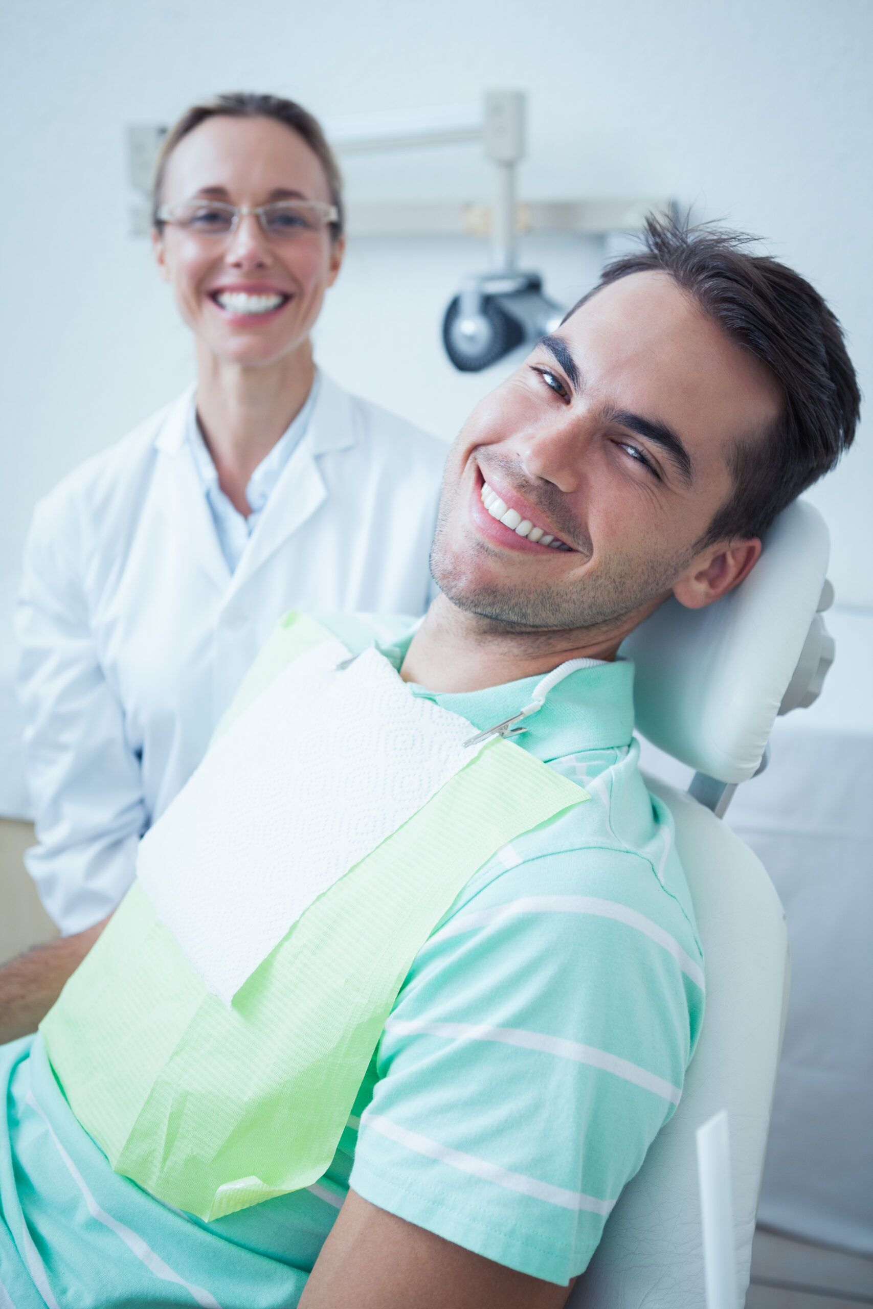 An adult patient and dental professional ready for a first visit